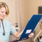 Family nurse practitioner reviewing patient chart in hospital room – how to choose a family nurse practitioner near me in 2025